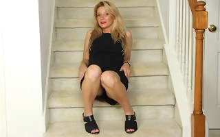 Naughty American MILF playing with her pussy on the stairs